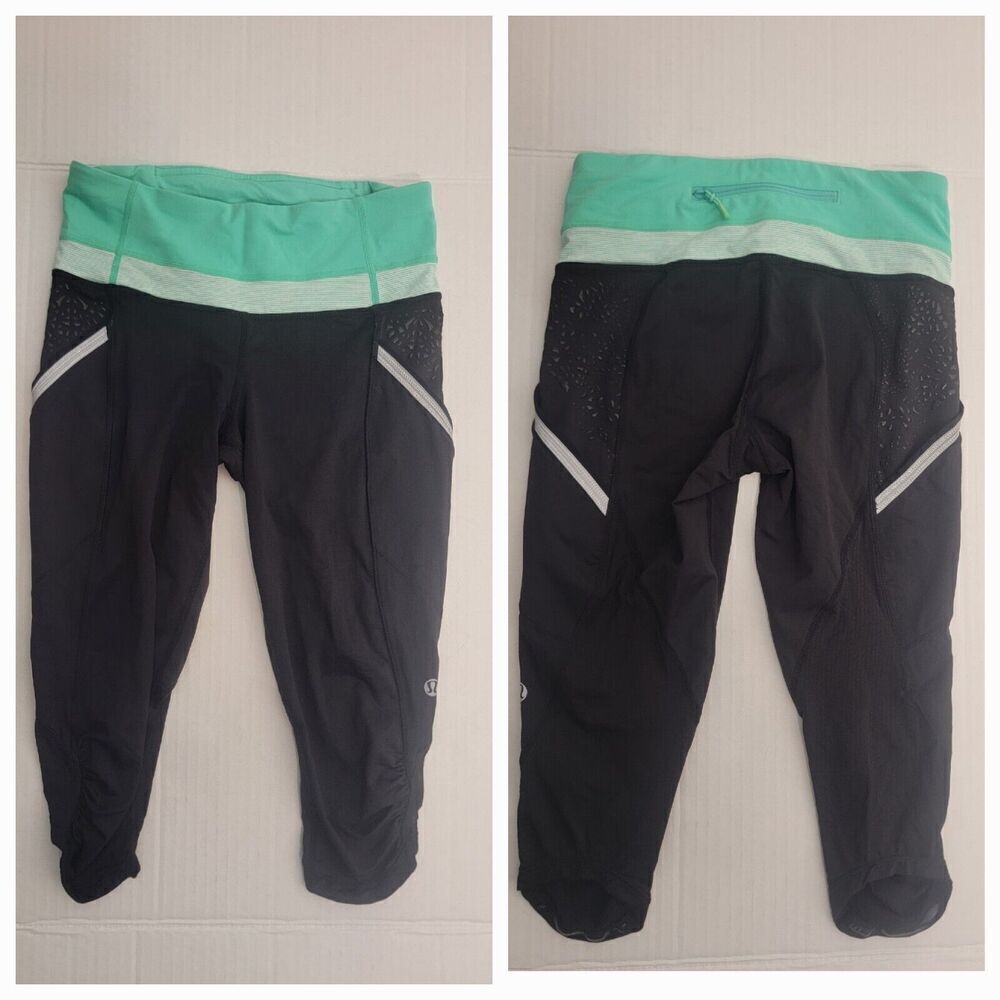 Lululemon Crop Leggings Womens SZ 4 Reflective Side Pockets Capri Black Green